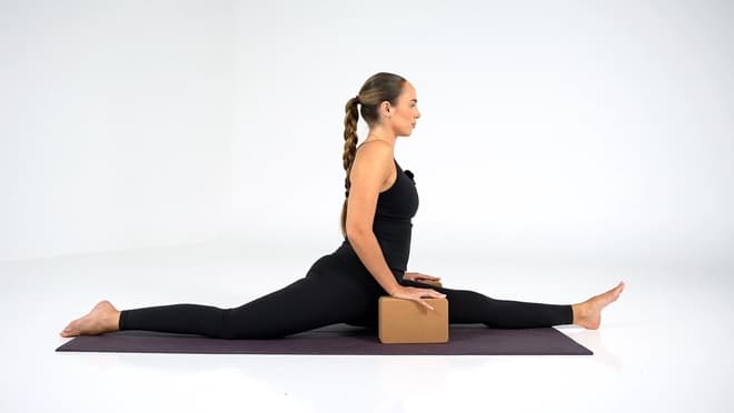 Standing Cross-Legged Side Stretch demonstrated by a certified trainer